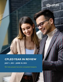 CPLED 2021/2022 Year in Review Cover page. Two young professionals looking down and smiling.